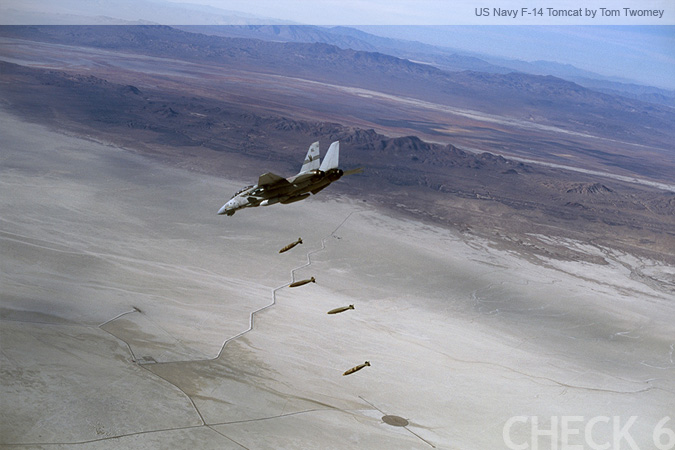 US Navy F-14 Tomcat Dropping Bombs on a Test Range - by Tom Twomey