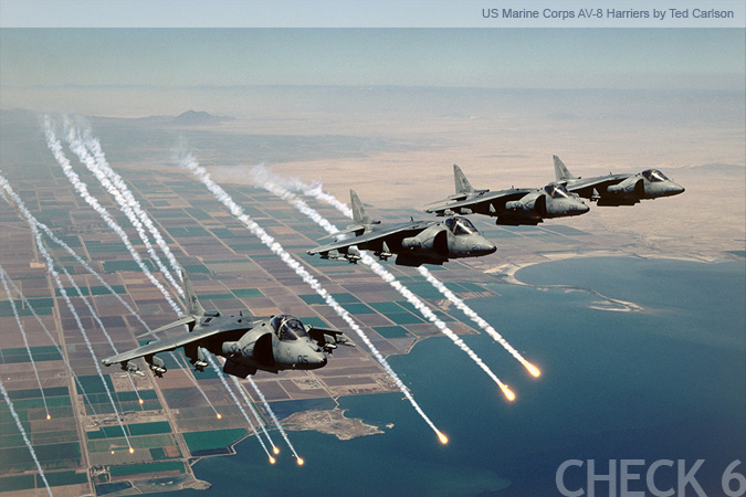 US Marine Corps AV-8 Harrier Flying in Formation While Dropping Flares - by Ted Carlson