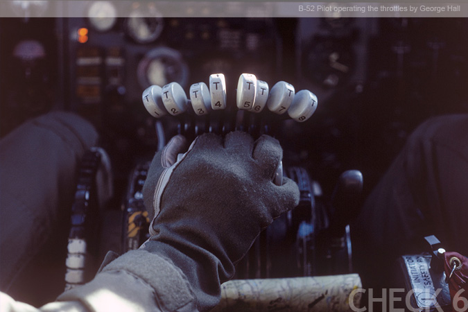B-52 Pilot operating the throttles - by George Hall