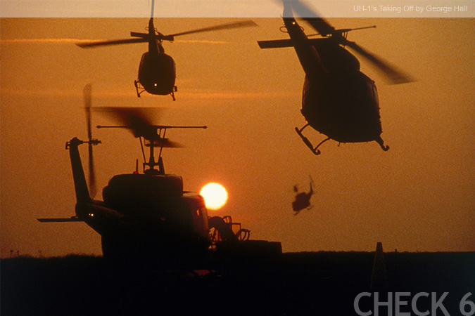 UH-1's Taking Off - by George Hall